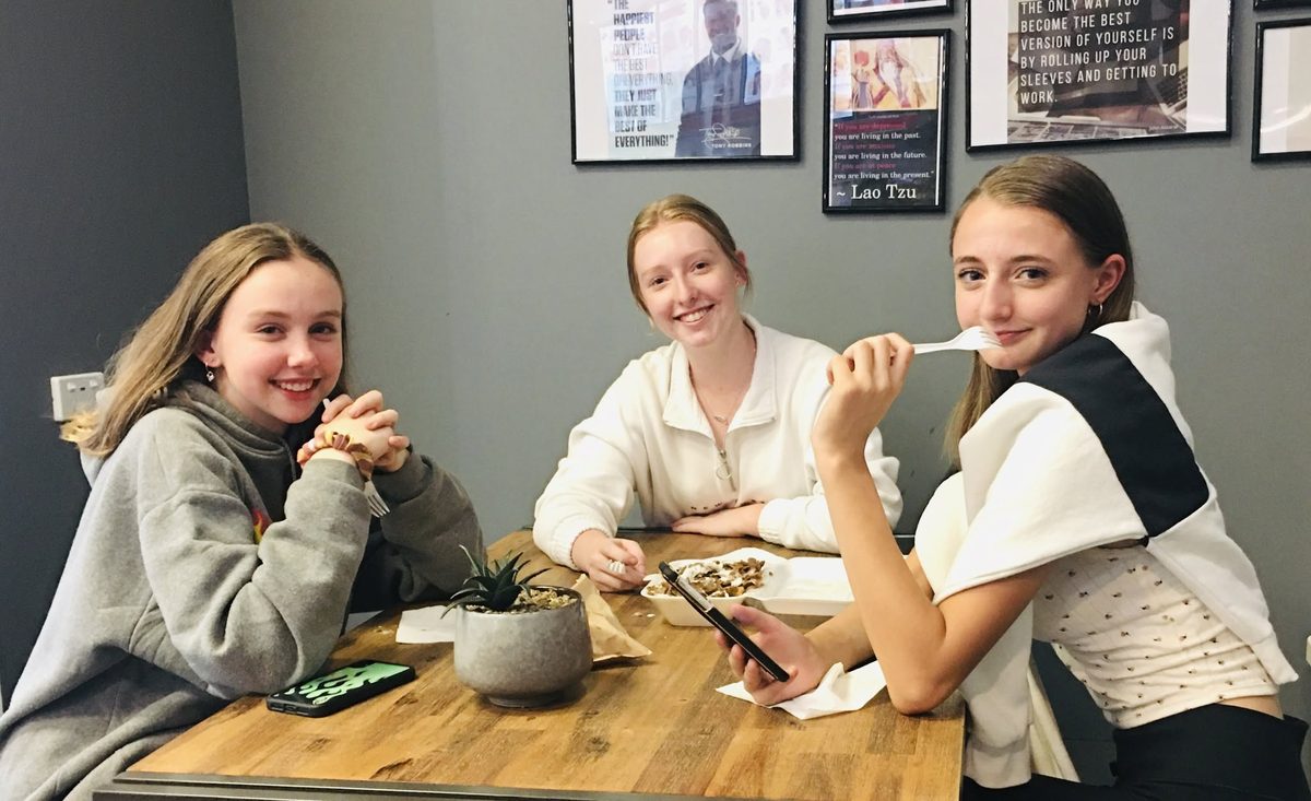 Happy customers enjoying Angie's food
